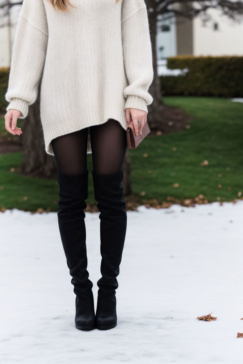 cozy yet oversized sweater and thigh high boots