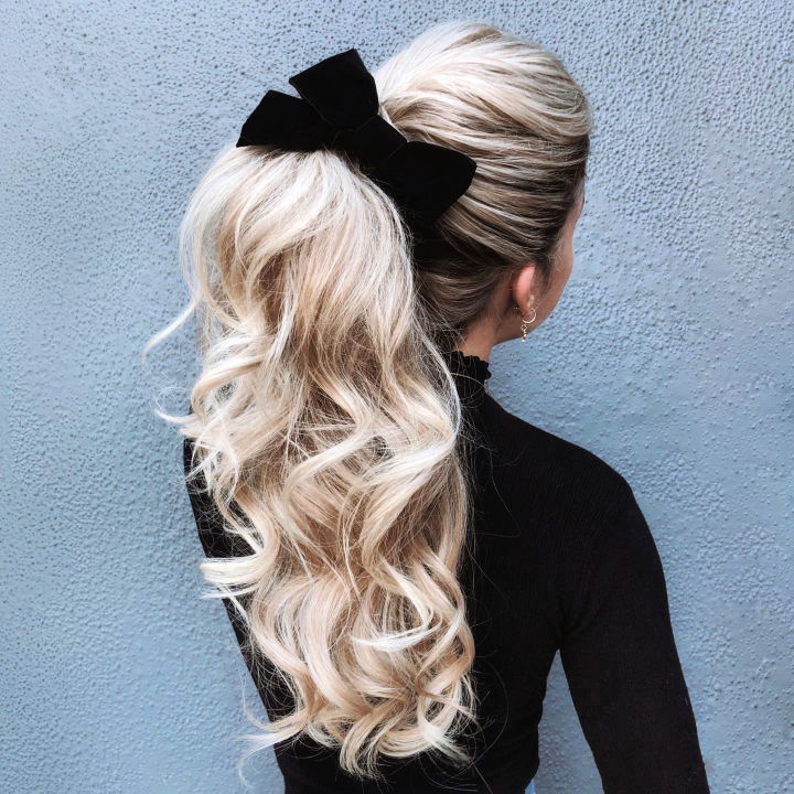 high ponytail with a bow hairstyle