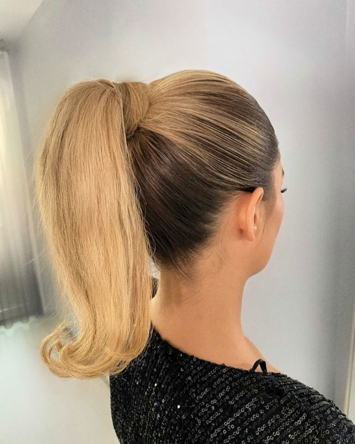 high ponytail with flicked ends