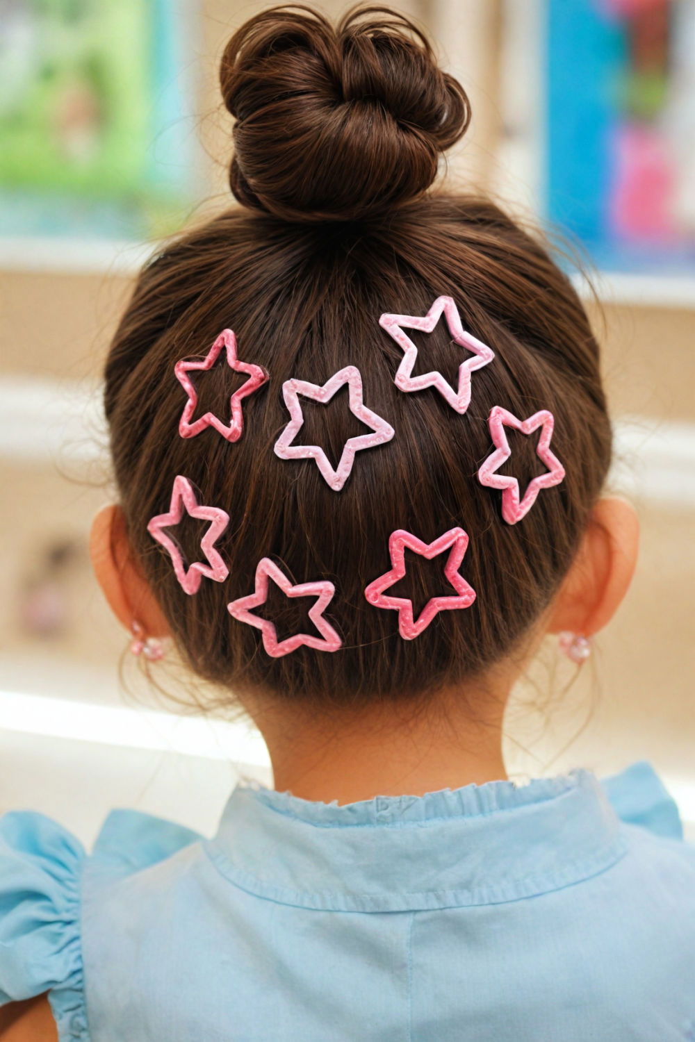 high puff with colorful barrettes hairstyle