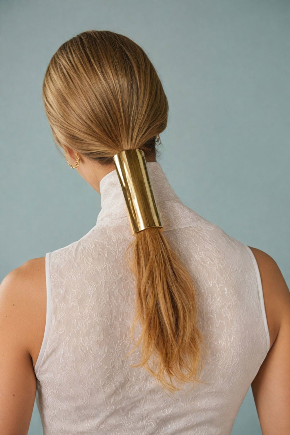 wavy ponytail with gold cuff hairstyle