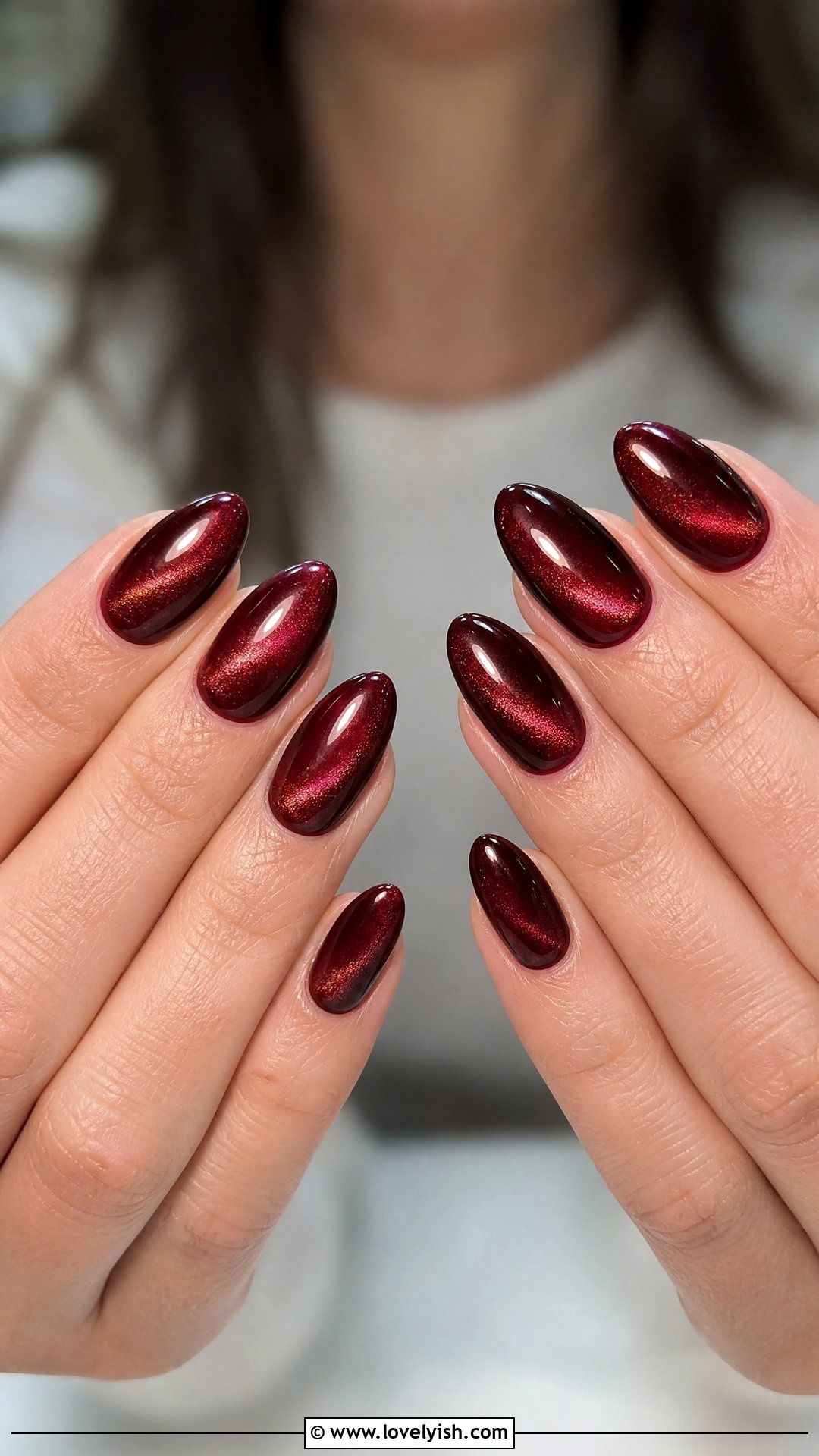 Burgundy Cat Eye Christmas Nails - 25 christmas nail designs - 25 christmas nail designs