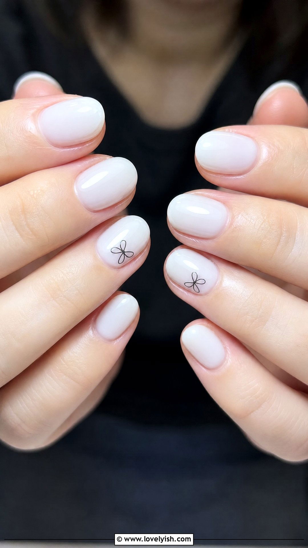 Milky White with Black Mini Bow Nails - 42 minimalist nail art - 42 minimalist nail art