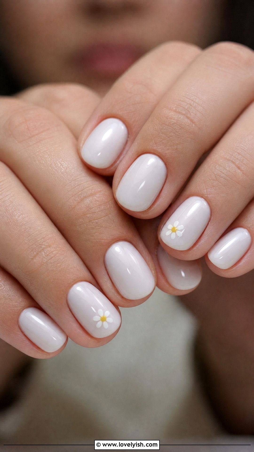 Milky White with Tiny Daisy Accent - 42 minimalist nail art - 42 minimalist nail art