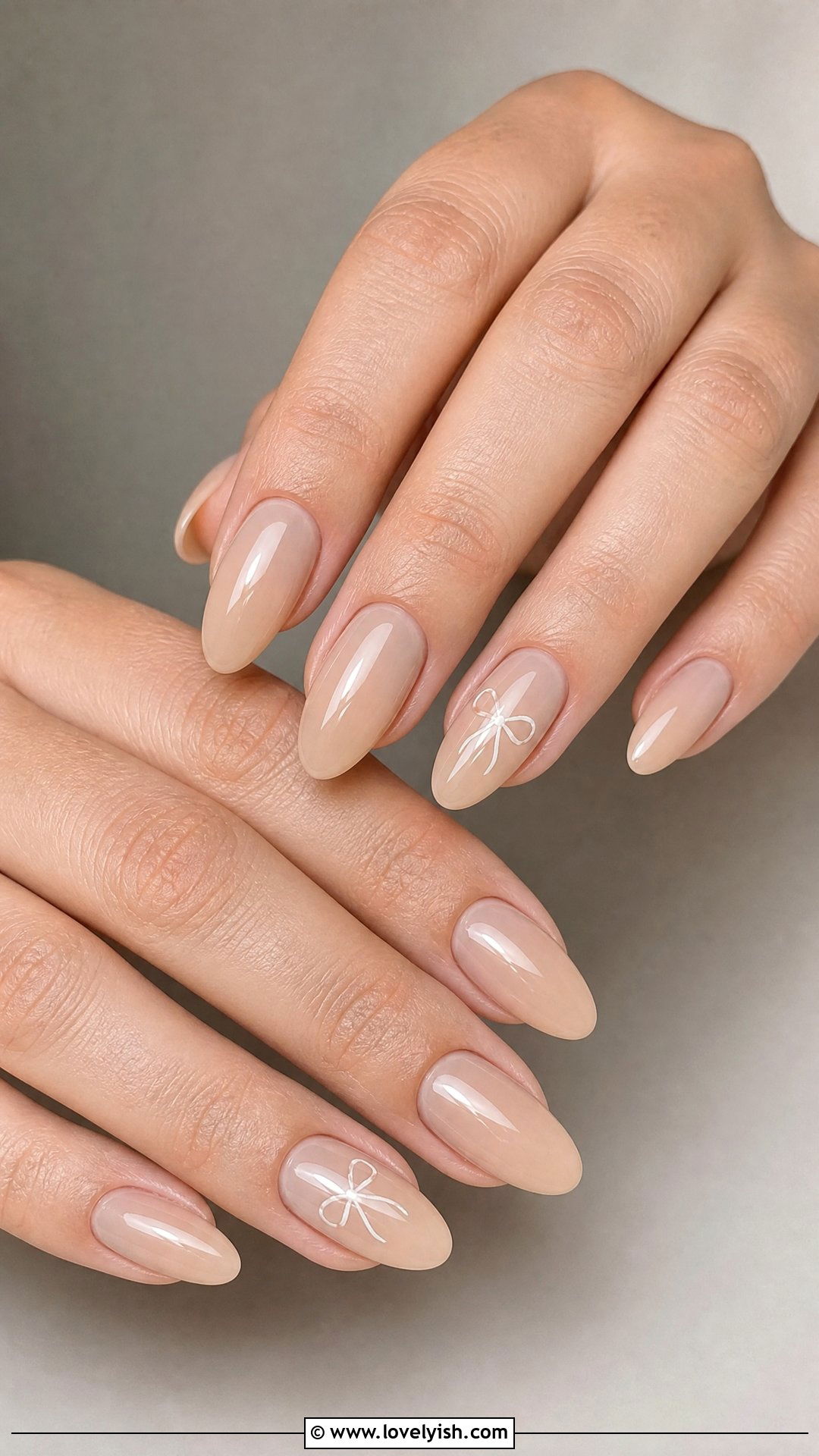 Sheer Nude Mini Bow Nails - 50 easy spring nail designs - 50 easy spring nail designs