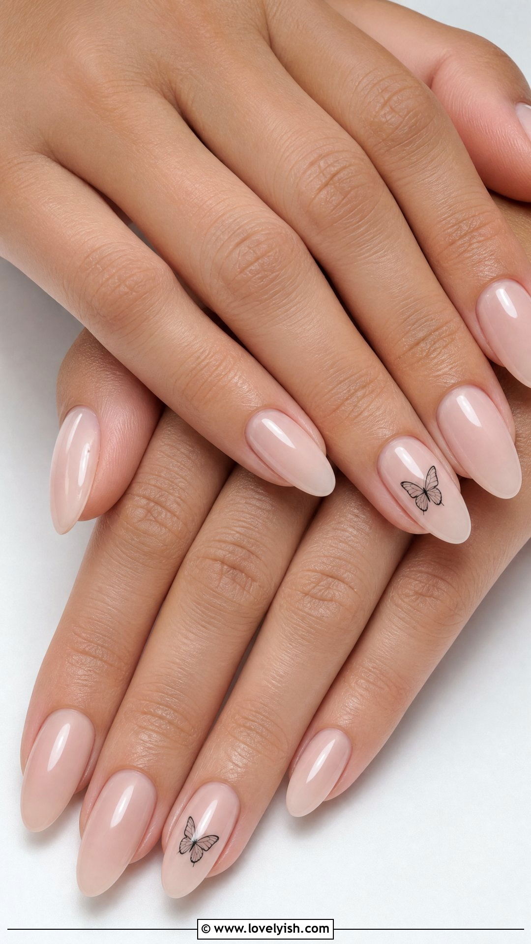 Sheer Nude with Tiny Butterfly Nails - 42 minimalist nail art - 42 minimalist nail art