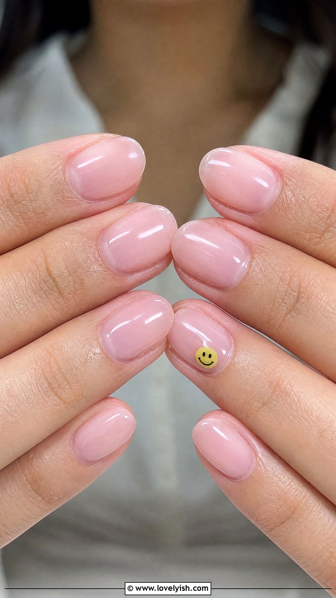 Sheer Pink with Smiley Face Accent Nails - 42 minimalist nail art - 42 minimalist nail art